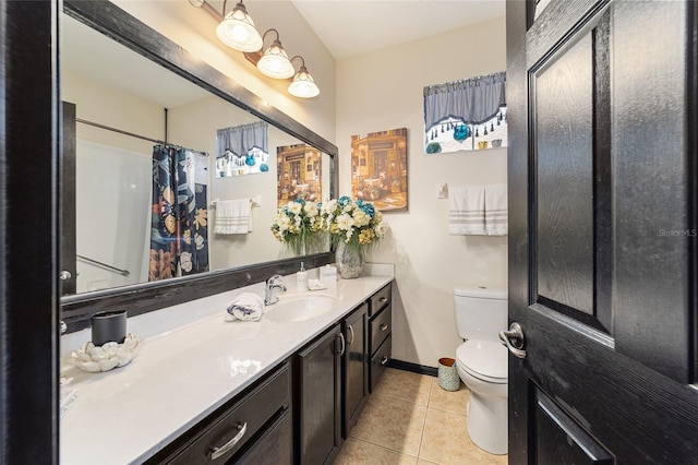 bathroom with vanity, curtained shower, tile patterned floors, and toilet