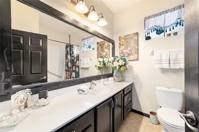 bathroom featuring tile patterned flooring, vanity, a shower with curtain, and toilet