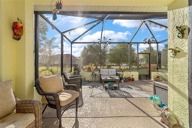 view of patio featuring glass enclosure