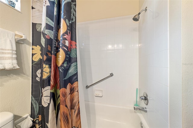 bathroom with shower / bathtub combination with curtain