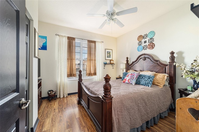 bedroom featuring dark wood-type flooring and ceiling fan