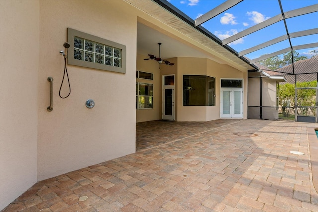 view of patio featuring ceiling fan and french doors