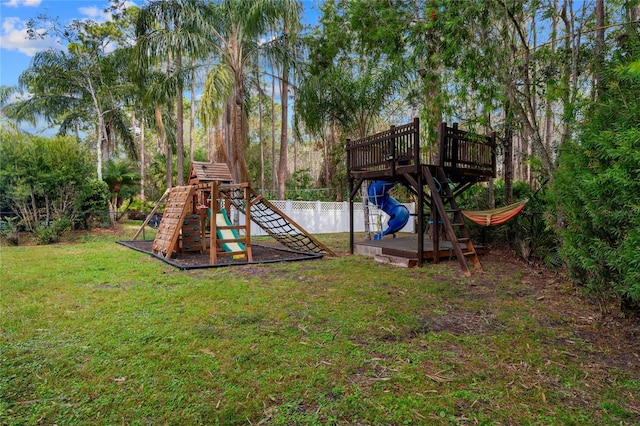 view of playground with a lawn