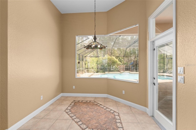 unfurnished dining area featuring light tile patterned flooring