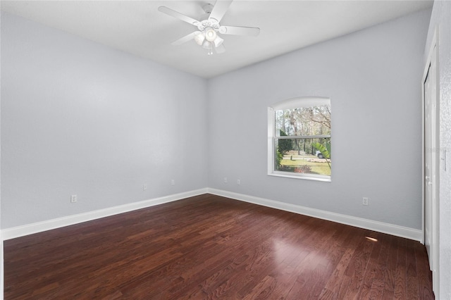 spare room featuring hardwood / wood-style floors and ceiling fan