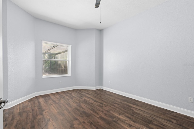 spare room with dark hardwood / wood-style floors