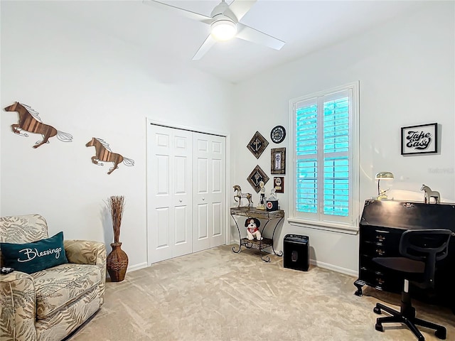 office space featuring light colored carpet and ceiling fan