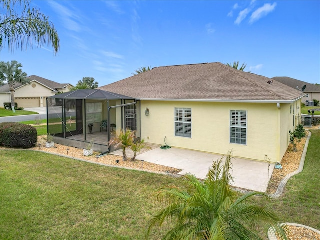 back of house featuring a patio, a lanai, a yard, and cooling unit