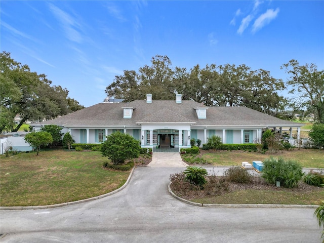 ranch-style house with a front yard