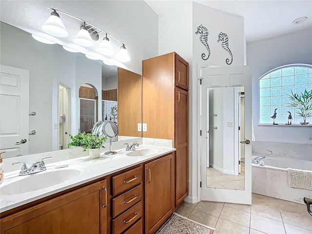 bathroom featuring tile patterned flooring, plus walk in shower, and vanity