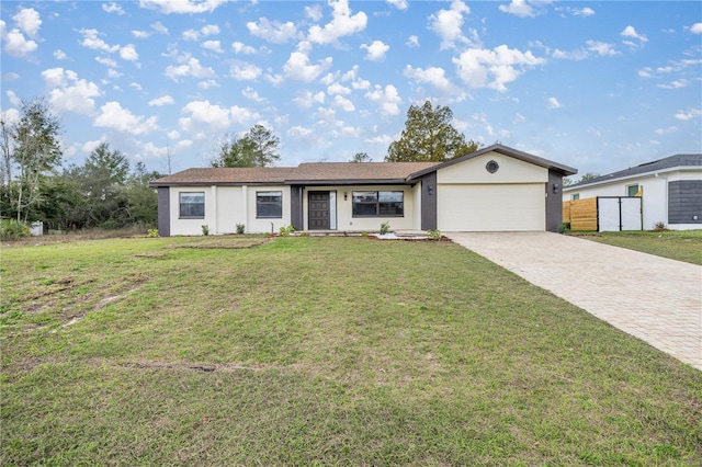 ranch-style house with a garage and a front yard