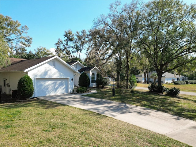 view of front of home featuring a garage and a front yard