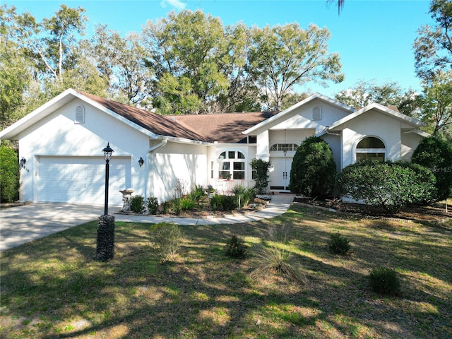 ranch-style home featuring a garage and a front lawn