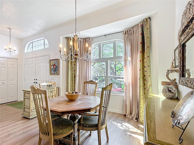 dining room featuring a chandelier and light hardwood / wood-style flooring