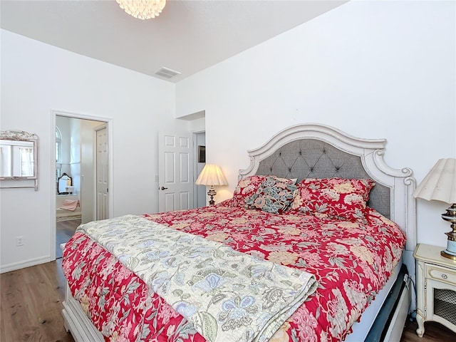 bedroom with hardwood / wood-style flooring