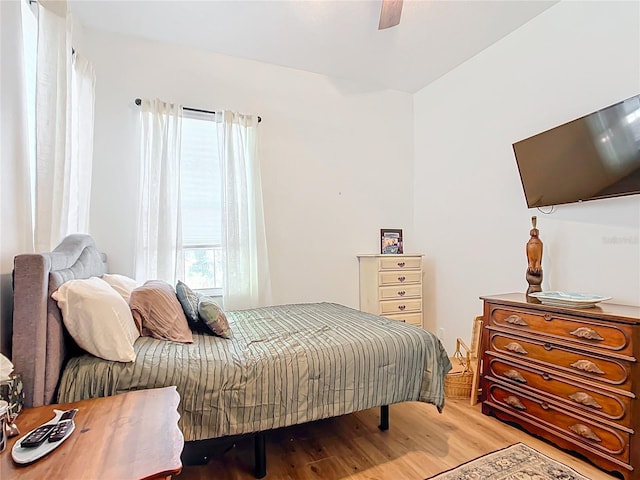 bedroom with ceiling fan and light hardwood / wood-style flooring