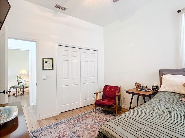 bedroom featuring a closet and light wood-type flooring