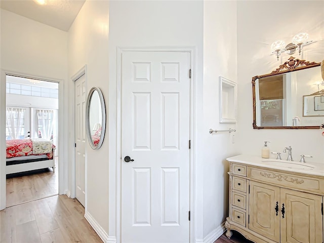 bathroom featuring vanity and wood-type flooring