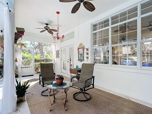 sunroom with french doors and ceiling fan