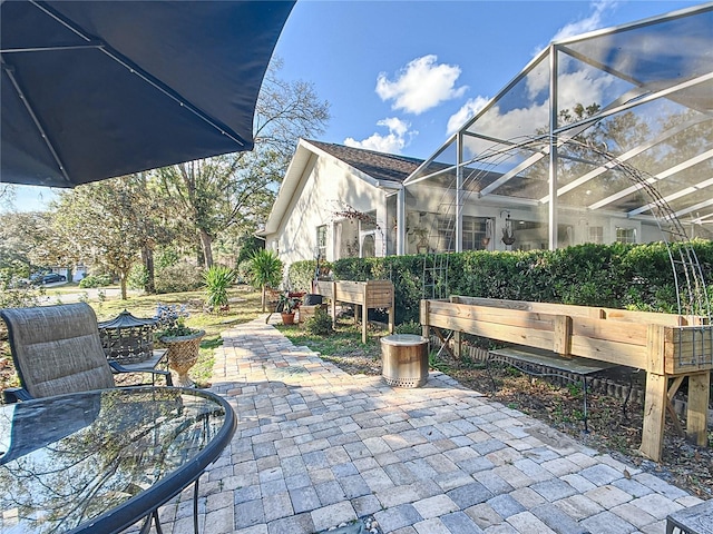 view of patio / terrace with glass enclosure