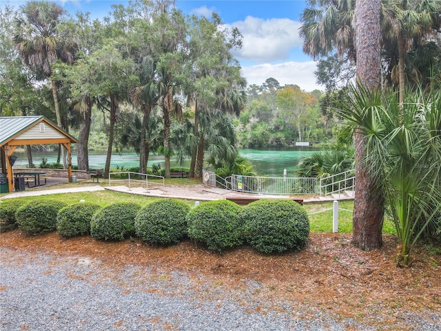 view of community featuring a gazebo and a water view