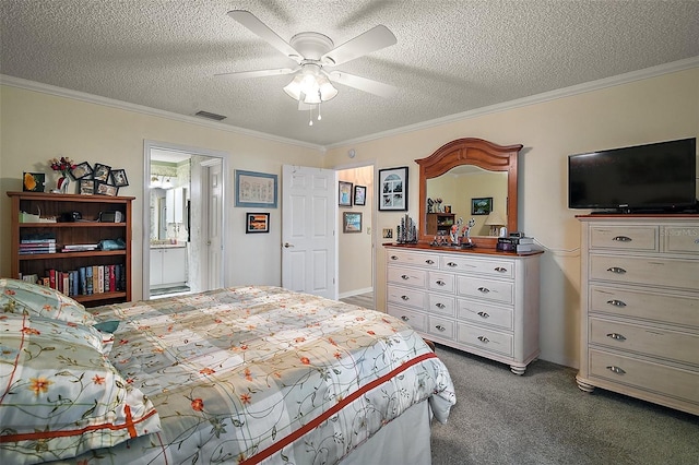 carpeted bedroom featuring ceiling fan, ornamental molding, and a textured ceiling
