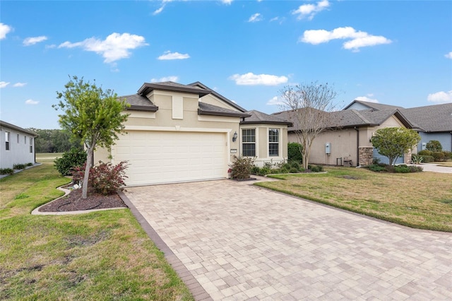 ranch-style home featuring a garage and a front lawn