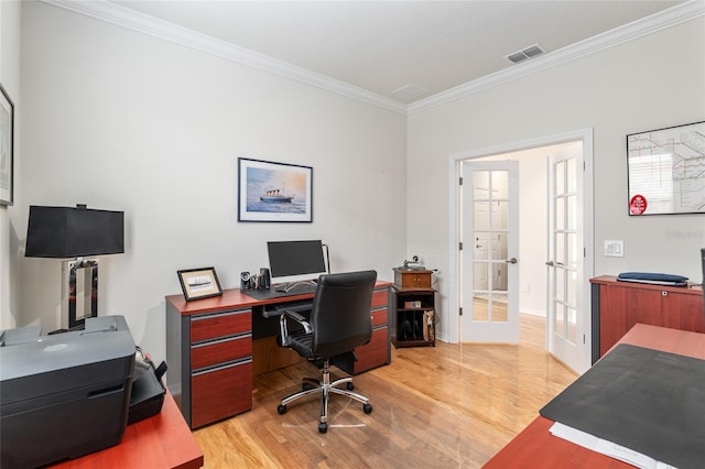 office area with french doors, ornamental molding, and light hardwood / wood-style floors