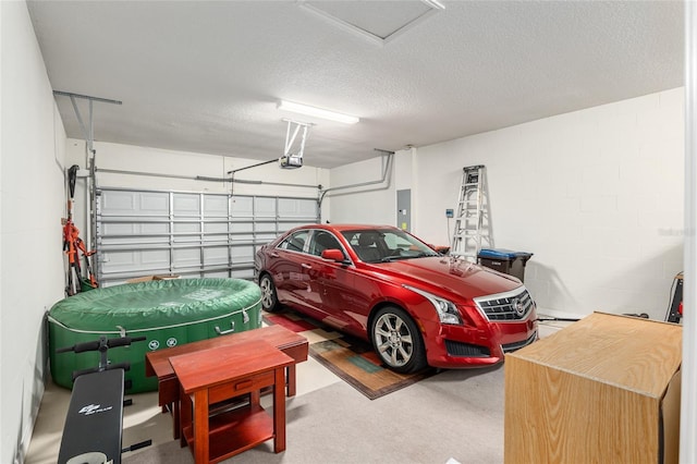 garage with a garage door opener and electric panel