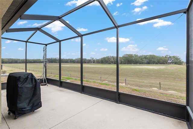 unfurnished sunroom featuring a rural view