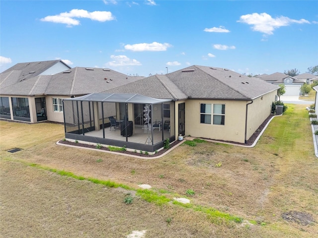 back of property featuring cooling unit, a yard, a patio, and glass enclosure