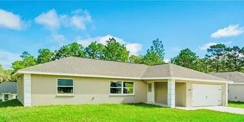 single story home featuring a garage and a front yard