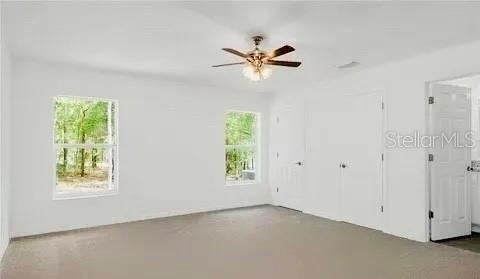 empty room featuring ceiling fan