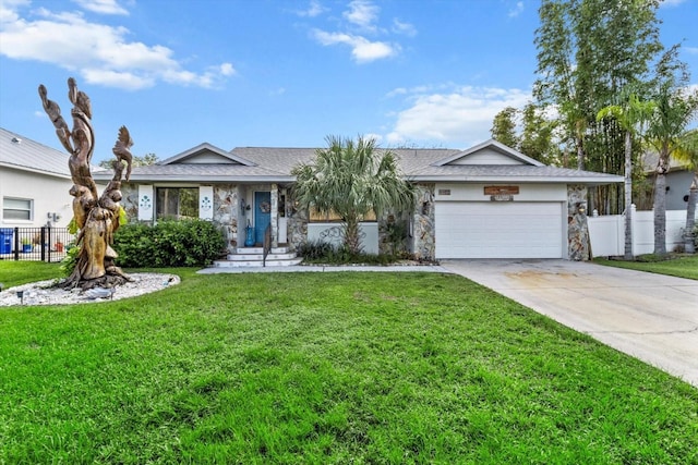 ranch-style home featuring a garage and a front lawn