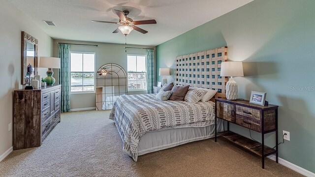 7128 SE 113th Ln, Belleview, FL 34420 - bedroom featuring light carpet and ceiling fan