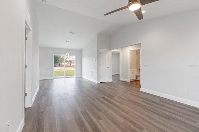 unfurnished room featuring ceiling fan, dark hardwood / wood-style flooring, and vaulted ceiling