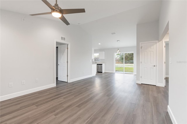 unfurnished living room with ceiling fan, wood-type flooring, and high vaulted ceiling