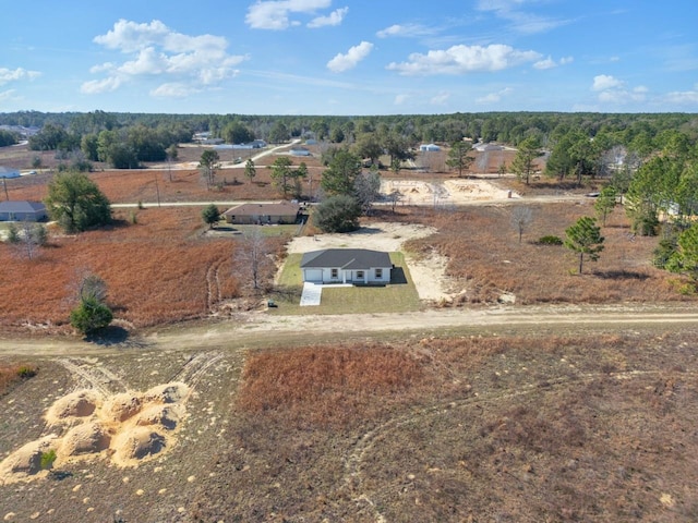 birds eye view of property featuring a rural view