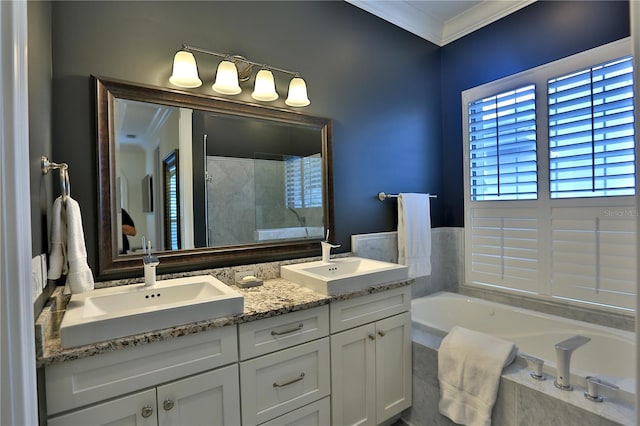 bathroom featuring ornamental molding, separate shower and tub, and vanity