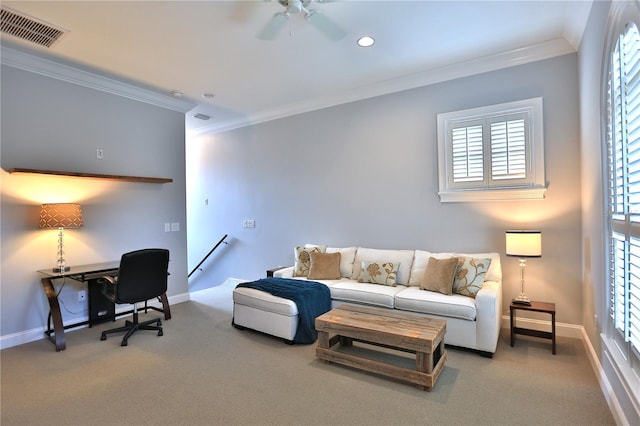 carpeted office space with ornamental molding and ceiling fan