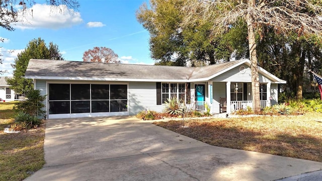 ranch-style house with a porch and a front yard