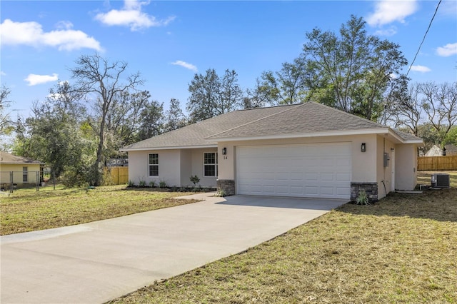 ranch-style house with cooling unit, a garage, and a front yard