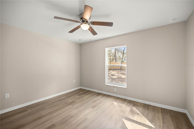 spare room with light hardwood / wood-style floors and ceiling fan