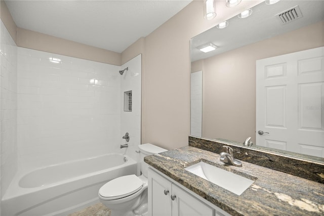 full bathroom with vanity, toilet, and tiled shower / bath combo