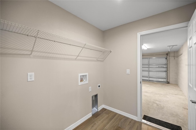 laundry area with washer hookup, hardwood / wood-style floors, and electric dryer hookup