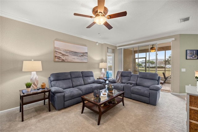 living room featuring light carpet, ornamental molding, and ceiling fan