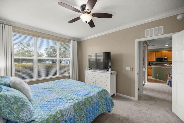 carpeted bedroom featuring crown molding, ceiling fan, and a textured ceiling