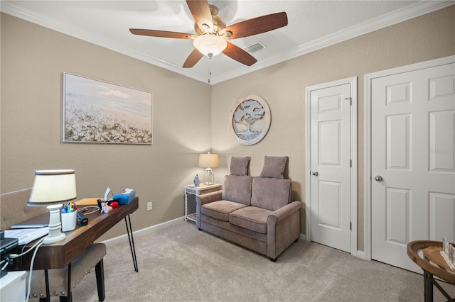 carpeted office featuring ceiling fan and ornamental molding