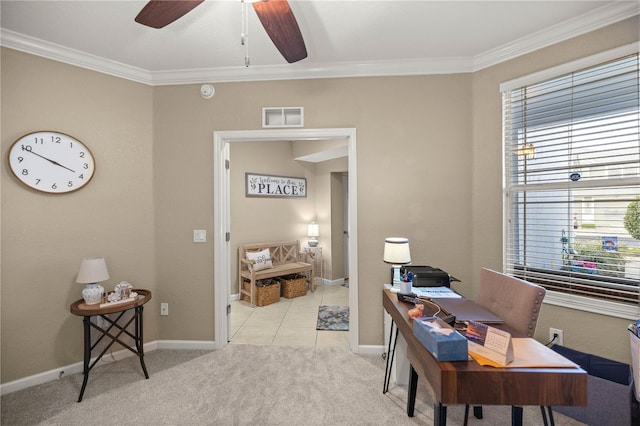 carpeted office space featuring crown molding and ceiling fan