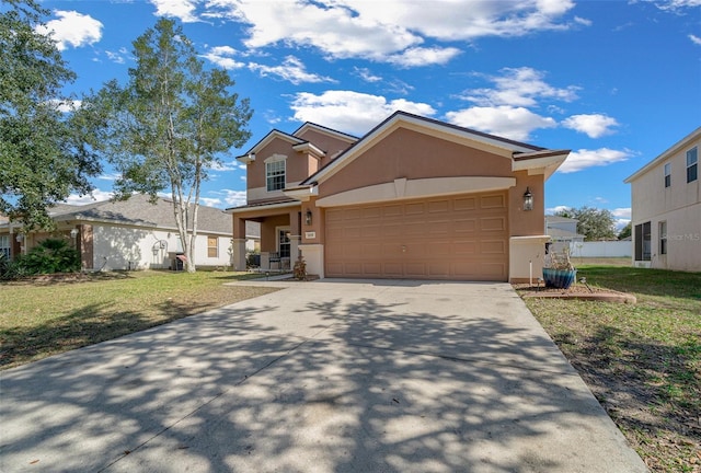 view of front of home featuring a garage and a front yard